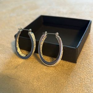 Sterling silver hoop earrings with CZ’s.